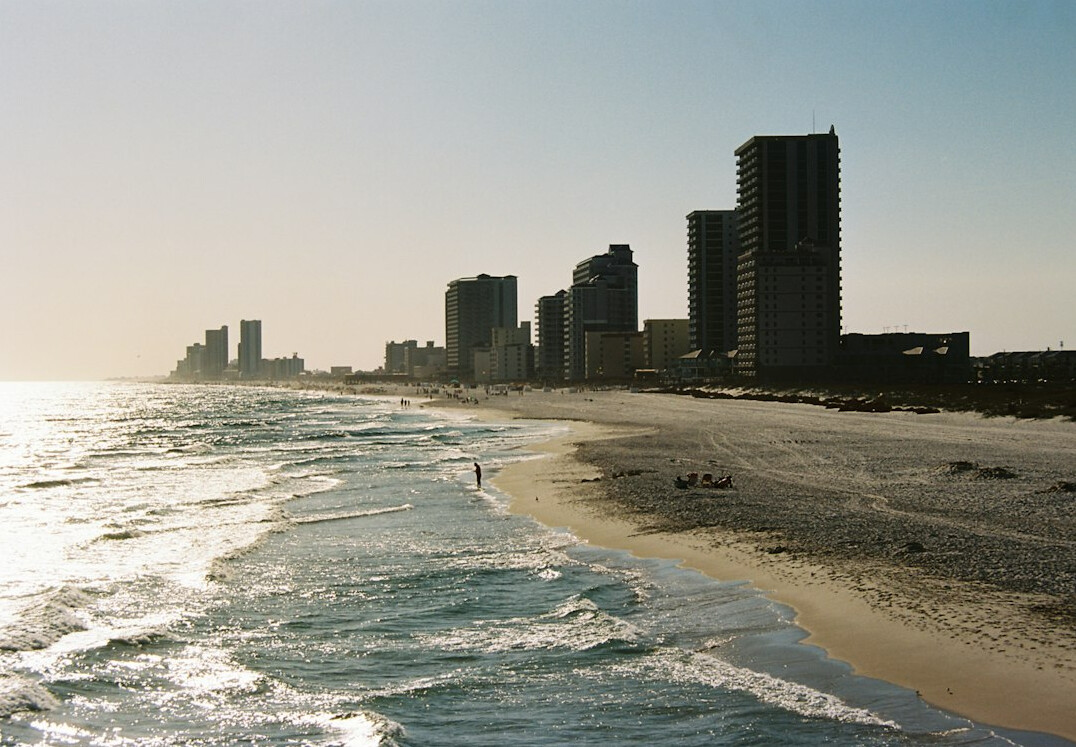 Coastal city skyline with high-rise buildings along the beach