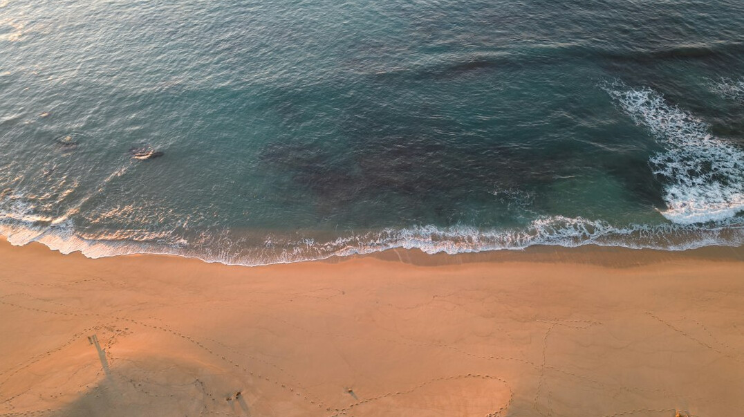 Aerial view of an oceanfront coastline at golden hour