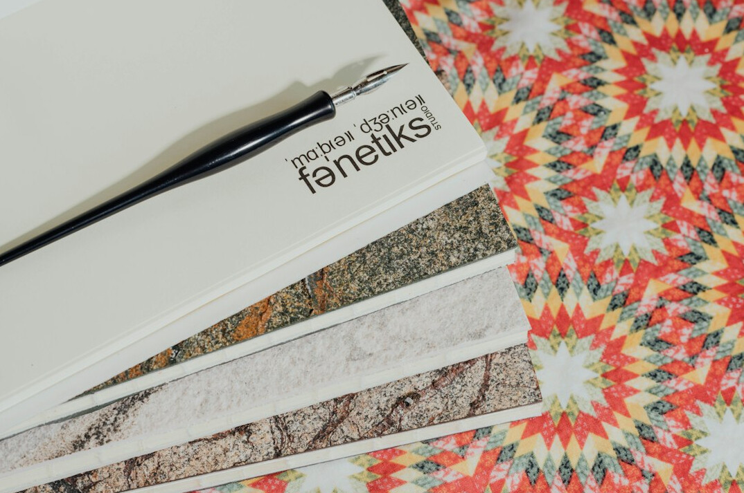 Flat lay of linen fabric, oak wood samples and travertine tile
